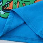 POLERA NIÑO  DE ALGODÓN DISEÑO DINOSAURIO.